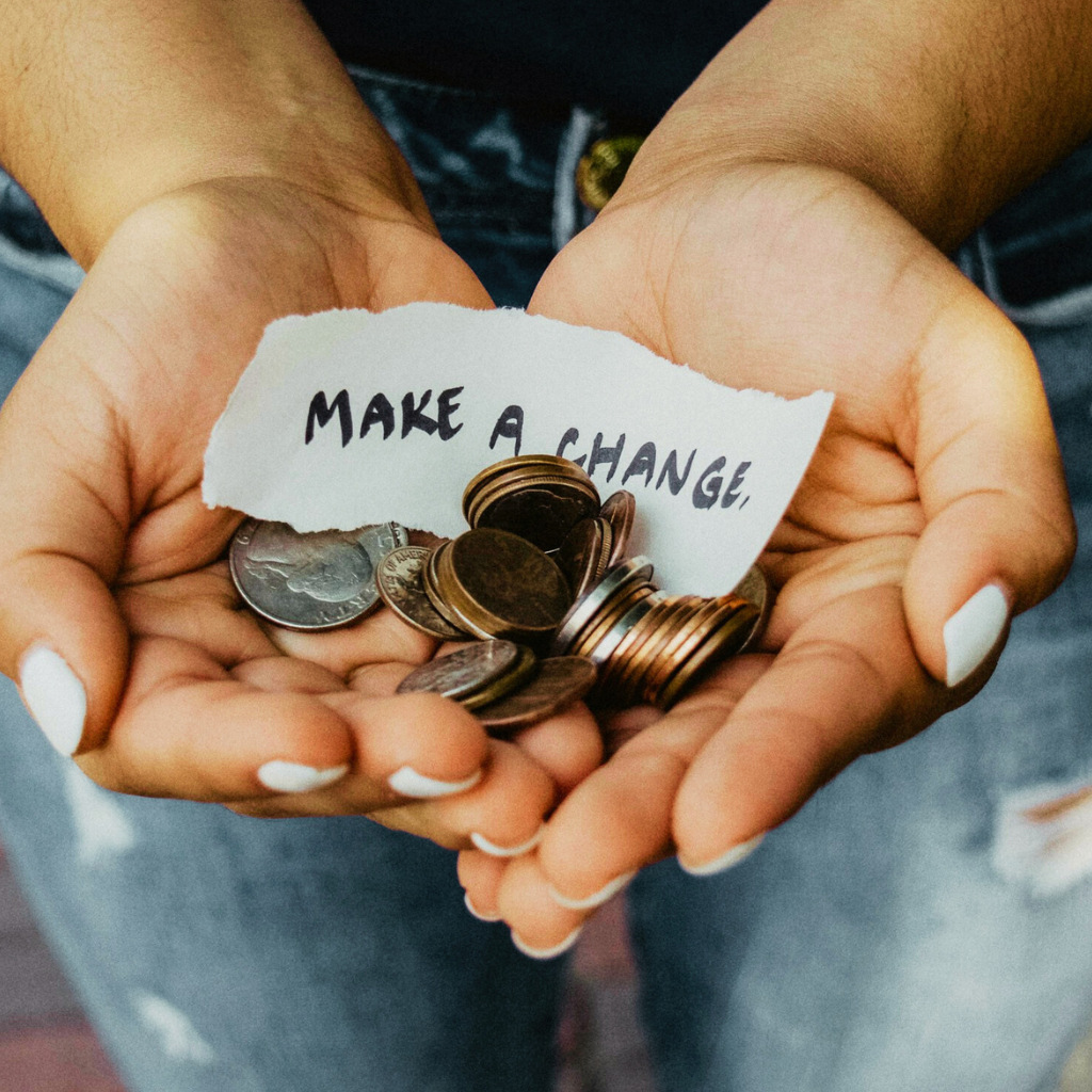 Photo of hands holding coins